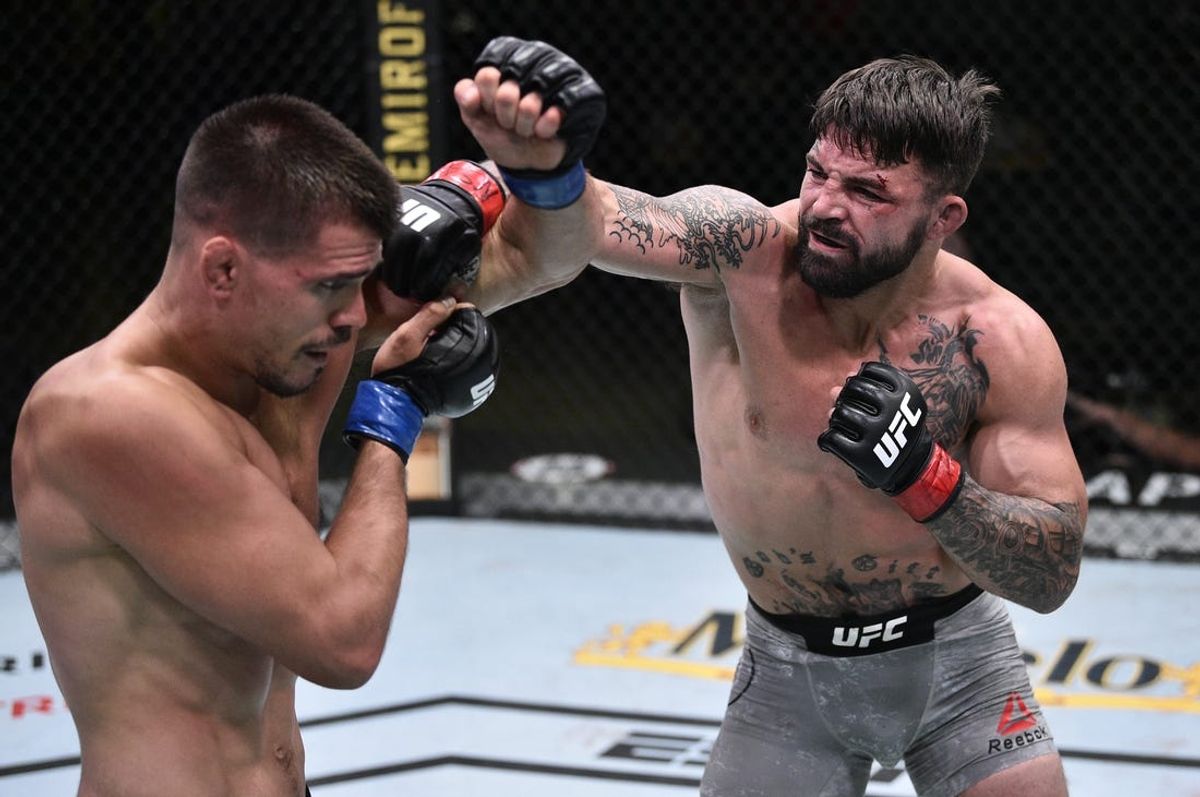 June 27, 2020; Las Vegas, NV, USA; Mike Perry (red gloves) punches Mickey Gall (blue gloves) during UFC Fight Night at the UFC APEX. Mandatory Credit: Chris Unger/Zuffa LLC via USA TODAY Sports