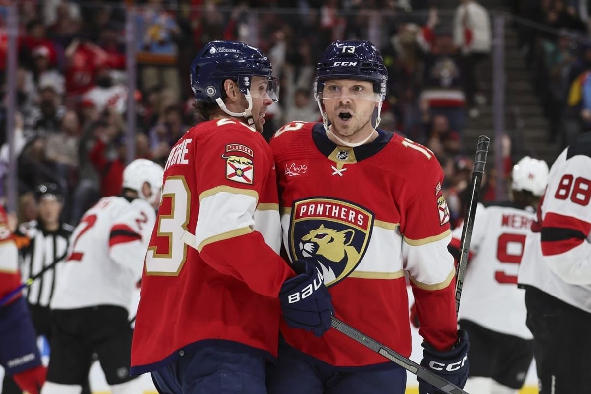 Jan 13, 2024; Sunrise, Florida, USA; Florida Panthers center Sam Reinhart (13) celebrates with center Carter Verhaeghe (23) after scoring against the New Jersey Devils during the second period at Amerant Bank Arena.