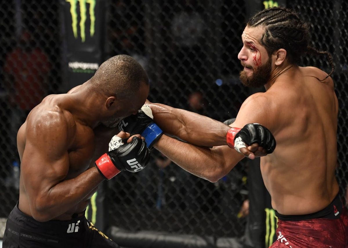 July 12, 2020; Abu Dhabi, UAE; Jorge Masvidal punches Kamaru Usman of Nigeria in their UFC welterweight championship fight during the UFC 251 event at Flash Forum on UFC Fight Island on July 12, 2020 on Yas Island, Abu Dhabi, United Arab Emirates.  Mandatory Credit: Jeff Bottari/Zuffa LLC via USA TODAY Sports
