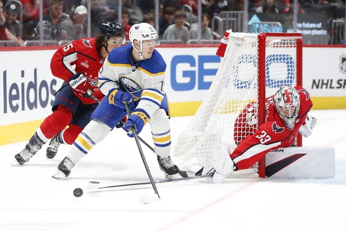 Sep 24, 2023; Washington, District of Columbia, USA; Washington Capitals goalie Clay Stevenson (33) makes a save against Buffalo Sabres forward Brandon Biro (15) during overtime at Capital One Arena.