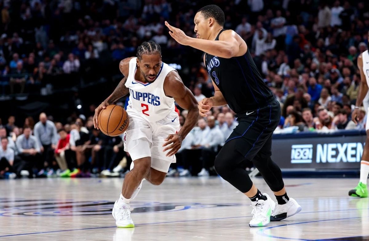 Dec 20, 2023; Dallas, Texas, USA;  LA Clippers forward Kawhi Leonard (2) controls the ball as Dallas Mavericks forward Grant Williams (3) defends during the second half at American Airlines Center.