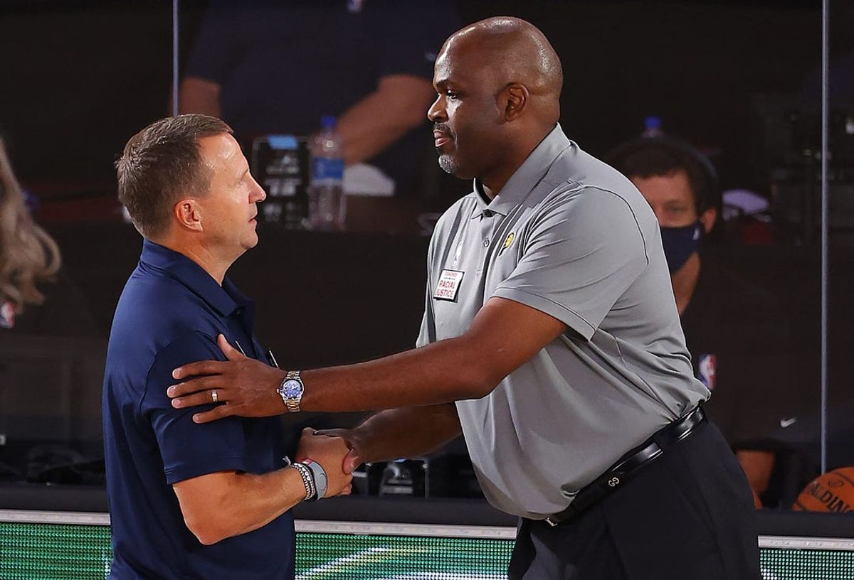 Aug 3, 2020; Lake Buena Vista, USA; Nate McMillan of the Indiana Pacers and Scott Brooks of the Washington Wizards shake hands after the game at VISA Athletic Center. Mandatory Credit: Mike Ehrmann/Pool Photo via USA TODAY Sports