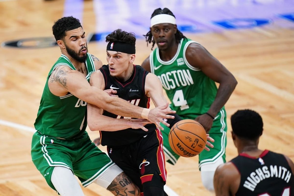 Apr 24, 2024; Boston, Massachusetts, USA; Miami Heat guard Tyler Herro (14) drivers the ball against Boston Celtics forward Jayson Tatum (0) in the second half during game two of the first round for the 2024 NBA playoffs at TD Garden.