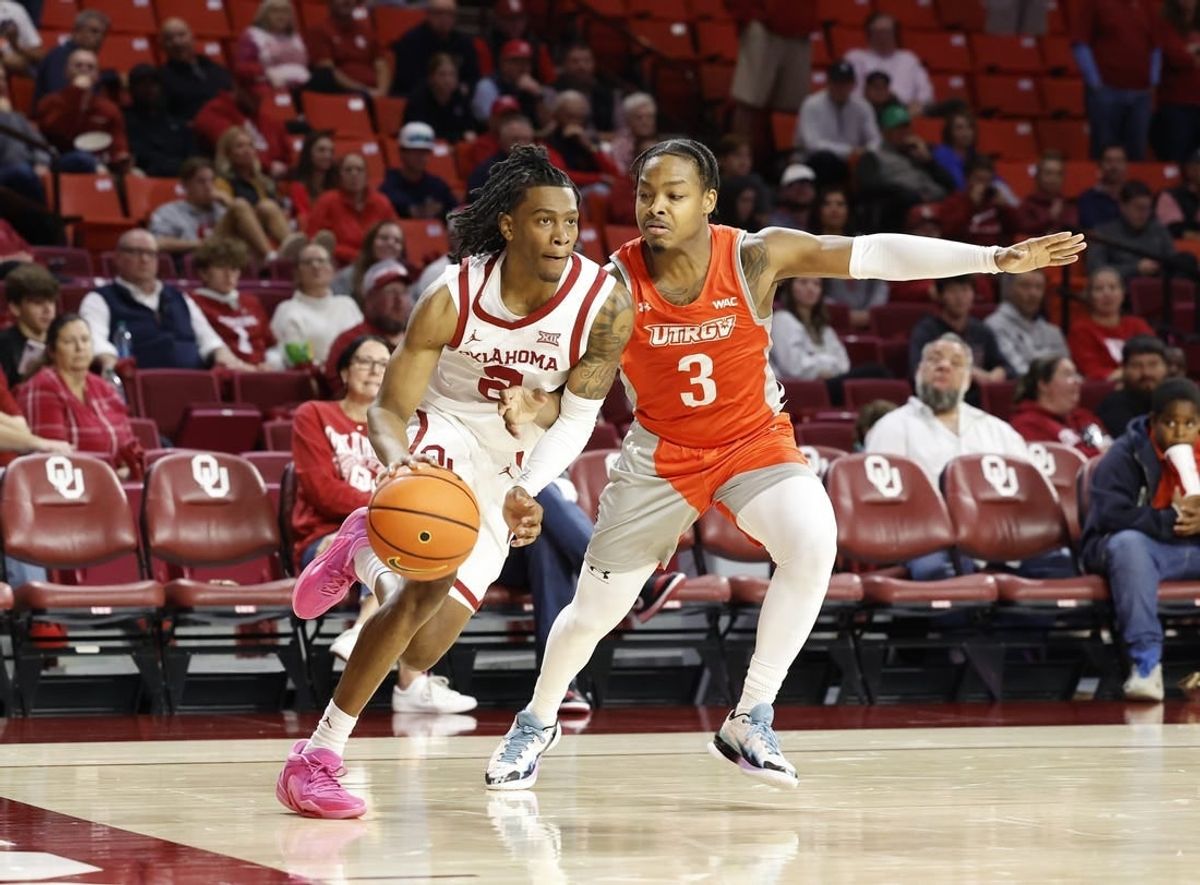 Nov 17, 2023; Norman, Oklahoma, USA; Oklahoma Sooners guard Javian McCollum (2) drives around UT Rio Grande Valley Vaqueros guard DeAnthony Tipler Jr. (3) during the second half at Lloyd Noble Center.