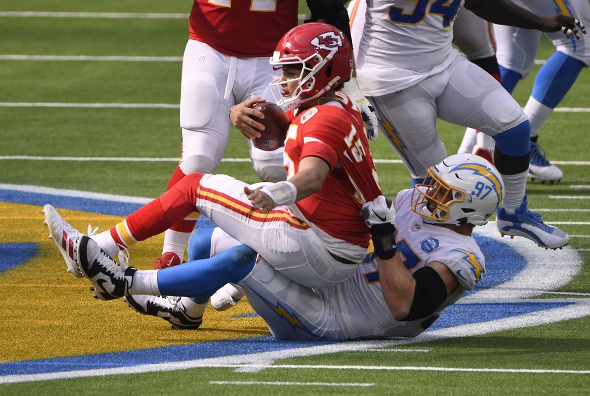 Sep 20, 2020; Inglewood, California, USA; Kansas City Chiefs quarterback Patrick Mahomes (15) is sacked by Los Angeles Chargers defensive end Joey Bosa (97) during the third quarter at SoFi Stadium. Mandatory Credit: Robert Hanashiro-Imagn Images