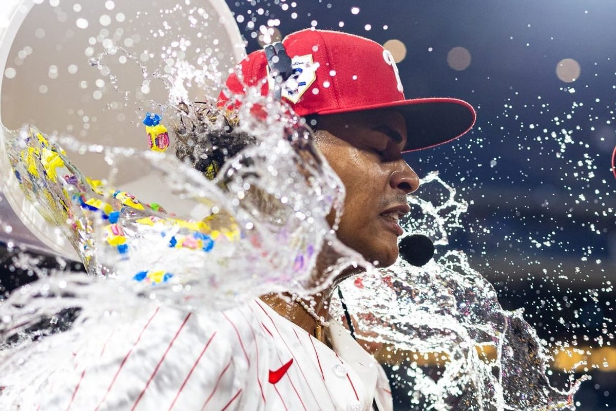 Apr 15, 2024; Philadelphia, Pennsylvania, USA; Philadelphia Phillies outfielder Cristian Pache is doused with water and gum after hitting a walk off RBI single during the tenth inning against the Colorado Rockies at Citizens Bank Park.