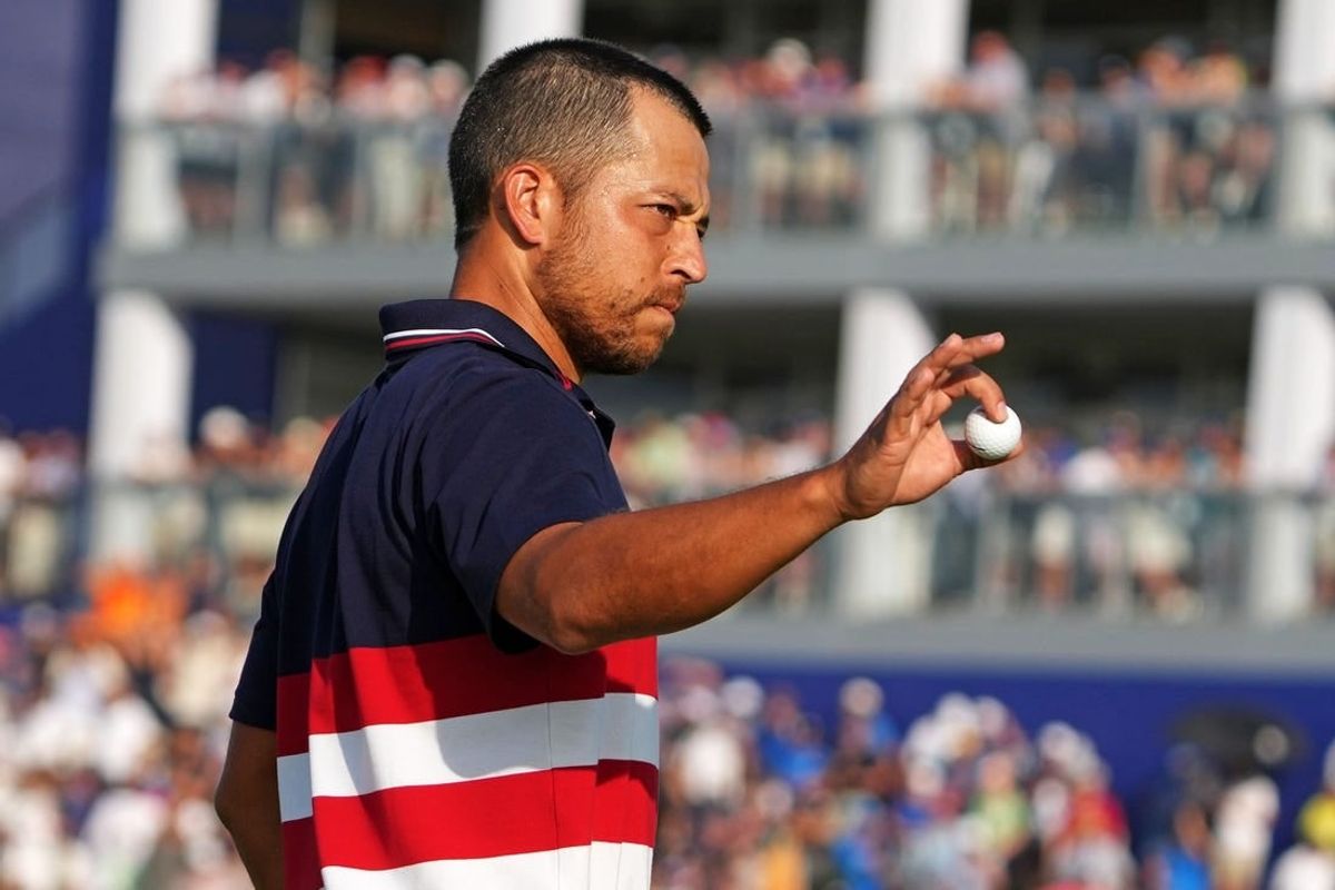 Oct 1, 2023; Rome, ITA; Team USA golfer Xander Schauffele waves after winning on the 16th hole during the final day of the 44th Ryder Cup golf competition at Marco Simone Golf and Country Club.