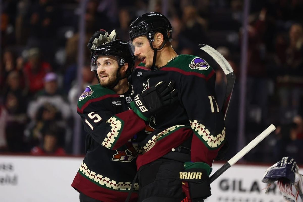 Dec 4, 2023; Tempe, Arizona, USA; Arizona Coyotes center Nick Bjugstad (17) celebrates with teammate Alexander Kerfoot (15) after scoring a goal against the Washington Capitals in the second period at Mullett Arena.