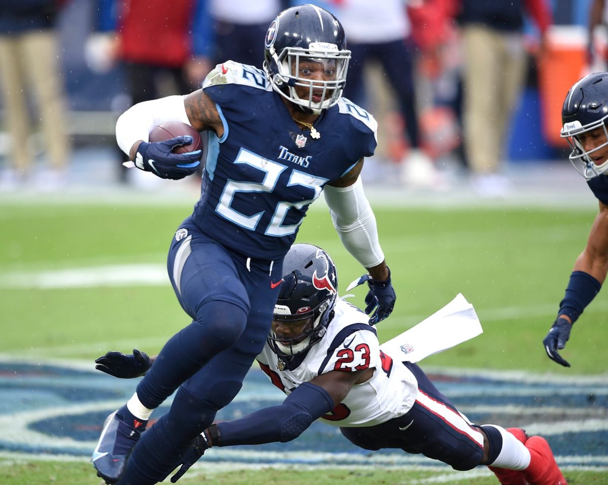 Tennessee Titans running back Derrick Henry (22) runs past Houston Texans cornerback Gareon Conley (22) during the first quarter at Nissan Stadium Sunday, Oct. 18, 2020 in Nashville, Tenn.

Gw46183