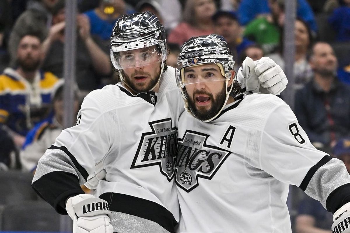 Mar 13, 2024; St. Louis, Missouri, USA;  Los Angeles Kings right wing Adrian Kempe (9) celebrates with defenseman Drew Doughty (8) after scoring against the St. Louis Blues during the third period at Enterprise Center.