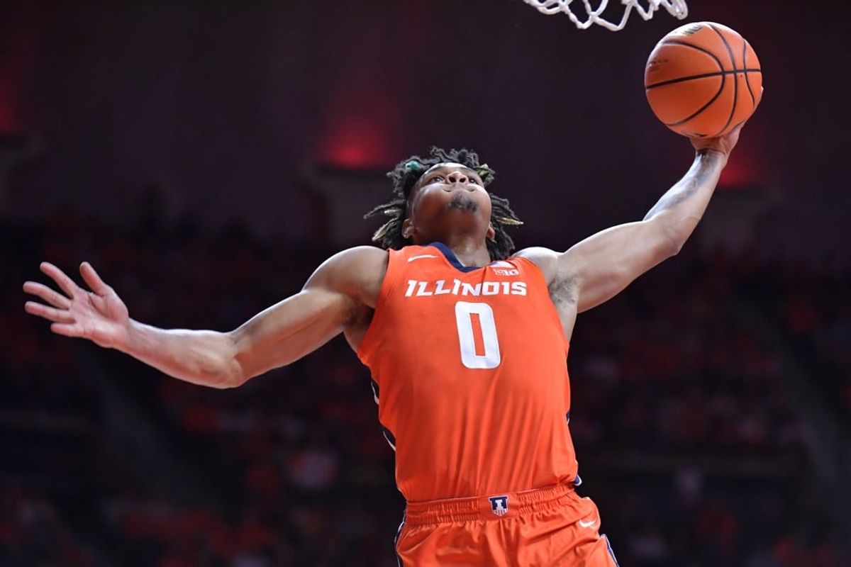 Nov 14, 2023; Champaign, Illinois, USA; Illinois Fighting Illini guard Terrence Shannon Jr. (0) dunks the ball during the first half against the Marquette Golden Eagles at State Farm Center.