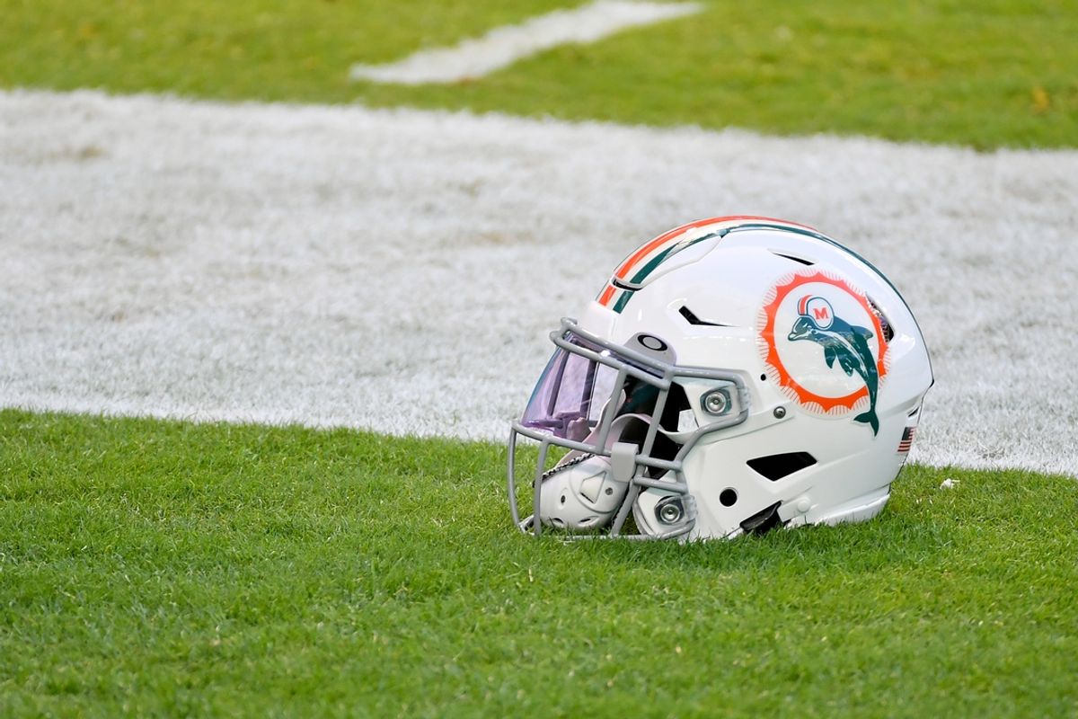 Dec 13, 2020; Miami Gardens, Florida, USA; A general view of a Miami Dolphins helmet with the throwback logo sits on the field prior to the game between the Miami Dolphins and the Kansas City Chiefs at Hard Rock Stadium. Mandatory Credit: Jasen Vinlove-Imagn Images