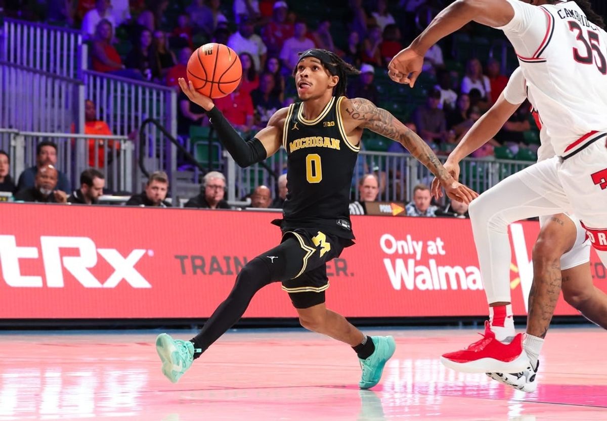 Nov 24, 2023; Paradise Island, BAHAMAS;  Michigan Wolverines guard Dug McDaniel (0) shoots during the second half against the Texas Tech Red Raiders at Imperial Arena.