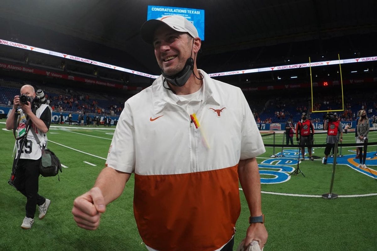 Dec 29, 2020; San Antonio, TX, USA; Texas Longhorns coach Tom Herman celebrates after defeating the Colorado Buffaloes in the Alamo Bowl at the Alamodome. Mandatory Credit: Kirby Lee-Imagn Images