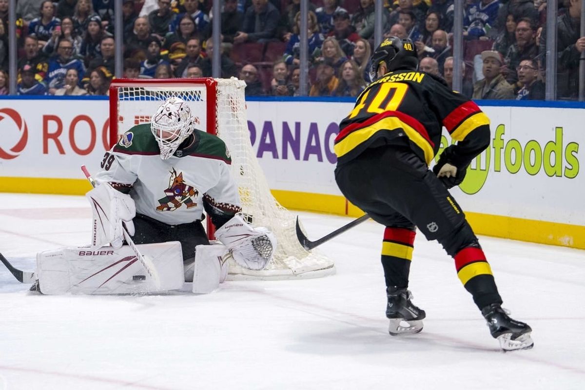 Apr 10, 2024; Vancouver, British Columbia, CAN; Arizona Coyotes goalie Connor Ingram (39) makes a save on Vancouver Canucks forward Elias Pettersson (40) in the first period at Rogers Arena.