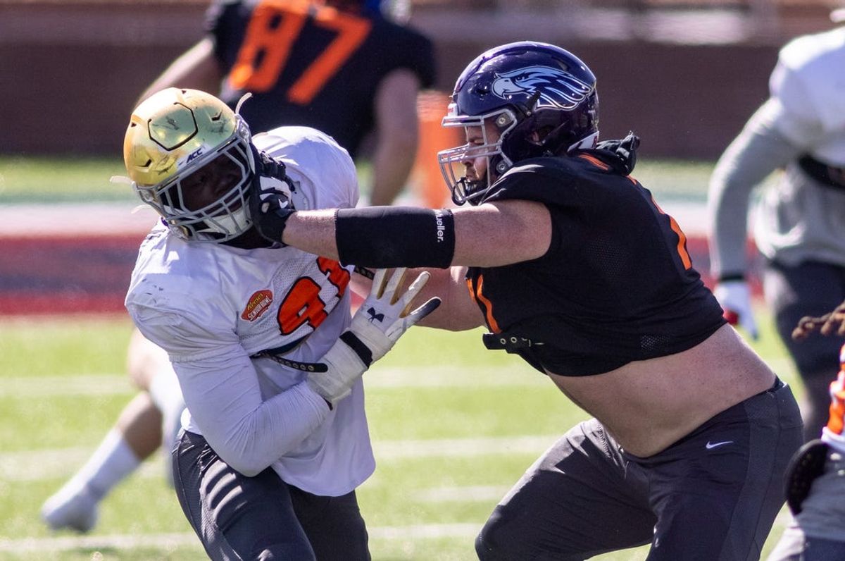 Jan 28, 2021; National defensive lineman Ade Ogundeji of Notre Dame (91) drills against National offensive lineman Quinn Meinerz of Wisconsin -Whitewater (71) during National practice at Hancock Whitney Stadium in Mobile, Alabama, USA;  Mandatory Credit: Vasha Hunt-USA TODAY Sports