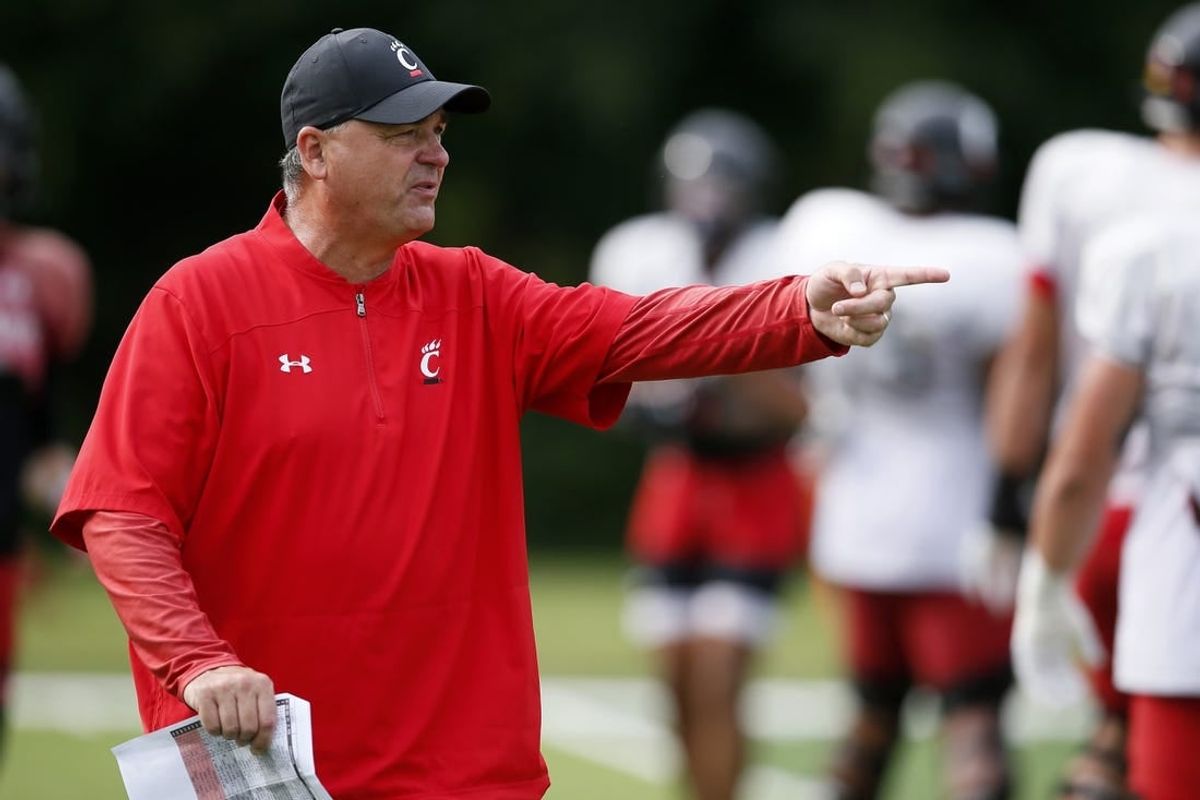 Aug 9, 2021; West Harrison, Indiana, USA; Cincinnati Bearcats offensive coordinator Mike Denbrock directs a drill during practice at the Higher Ground training facility.