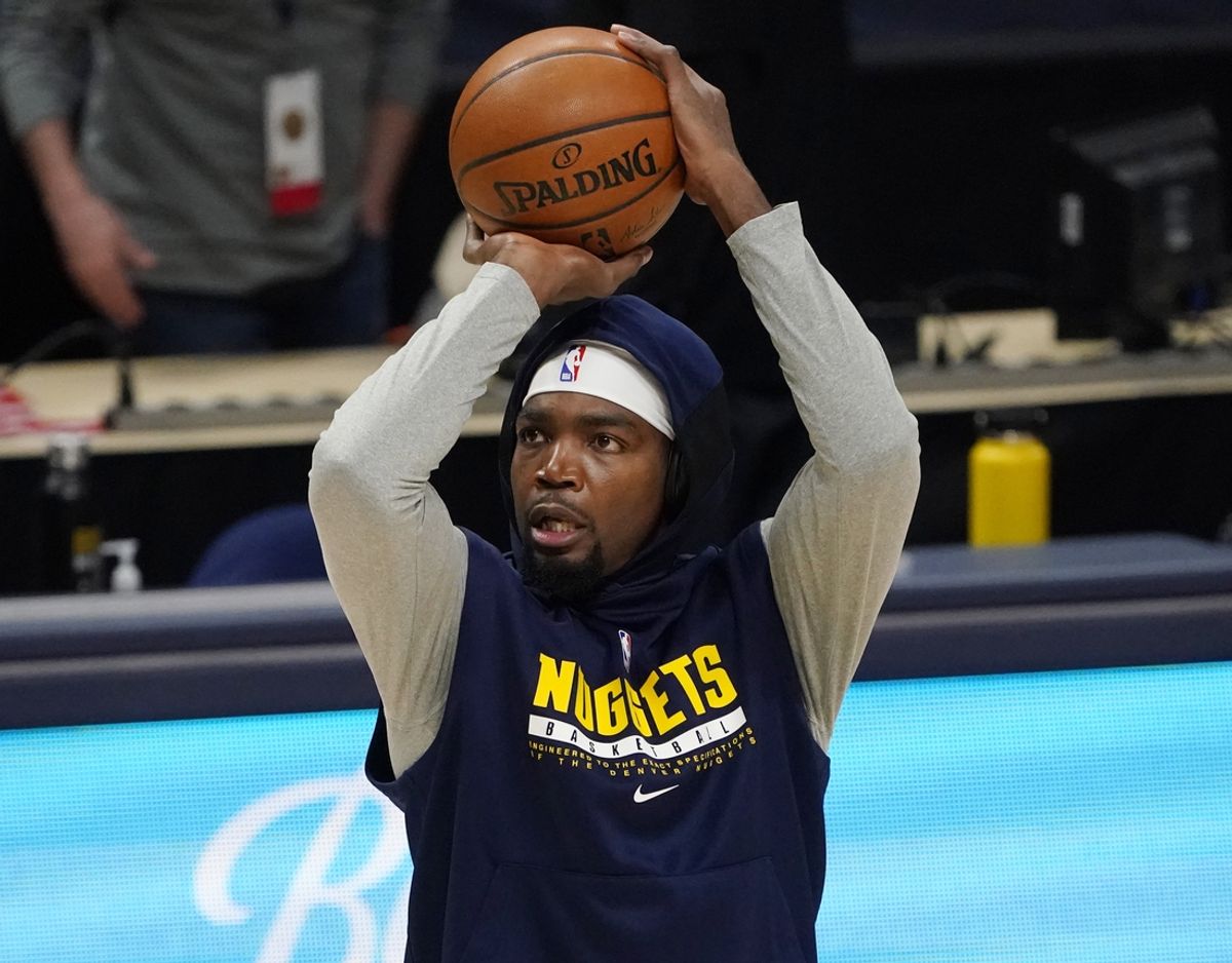 Feb 12, 2021; Denver, Colorado, USA;  Denver Nuggets forward Paul Millsap (4) warms up before a game against the Cleveland Cavaliers at Ball Arena. Mandatory Credit: Ron Chenoy-Imagn Images