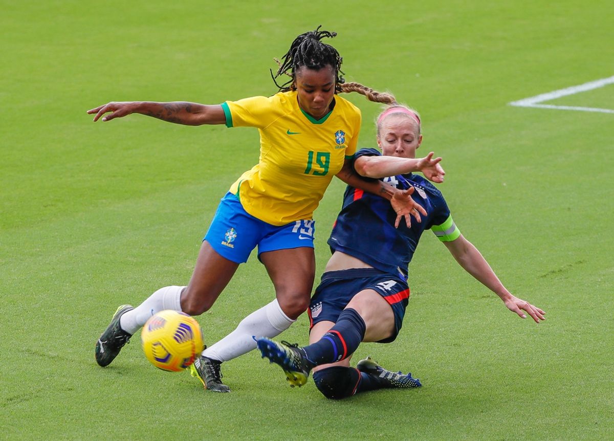 Feb 21, 2021; Orlando, Florida, USA; Brazil forward Ludmila (19) and United States Becky Sauerbrunn (4) battle for the ball during the first half of the She Believes Cup soccer match at Exploria Stadium. Mandatory Credit: Mike Watters-USA TODAY Sports