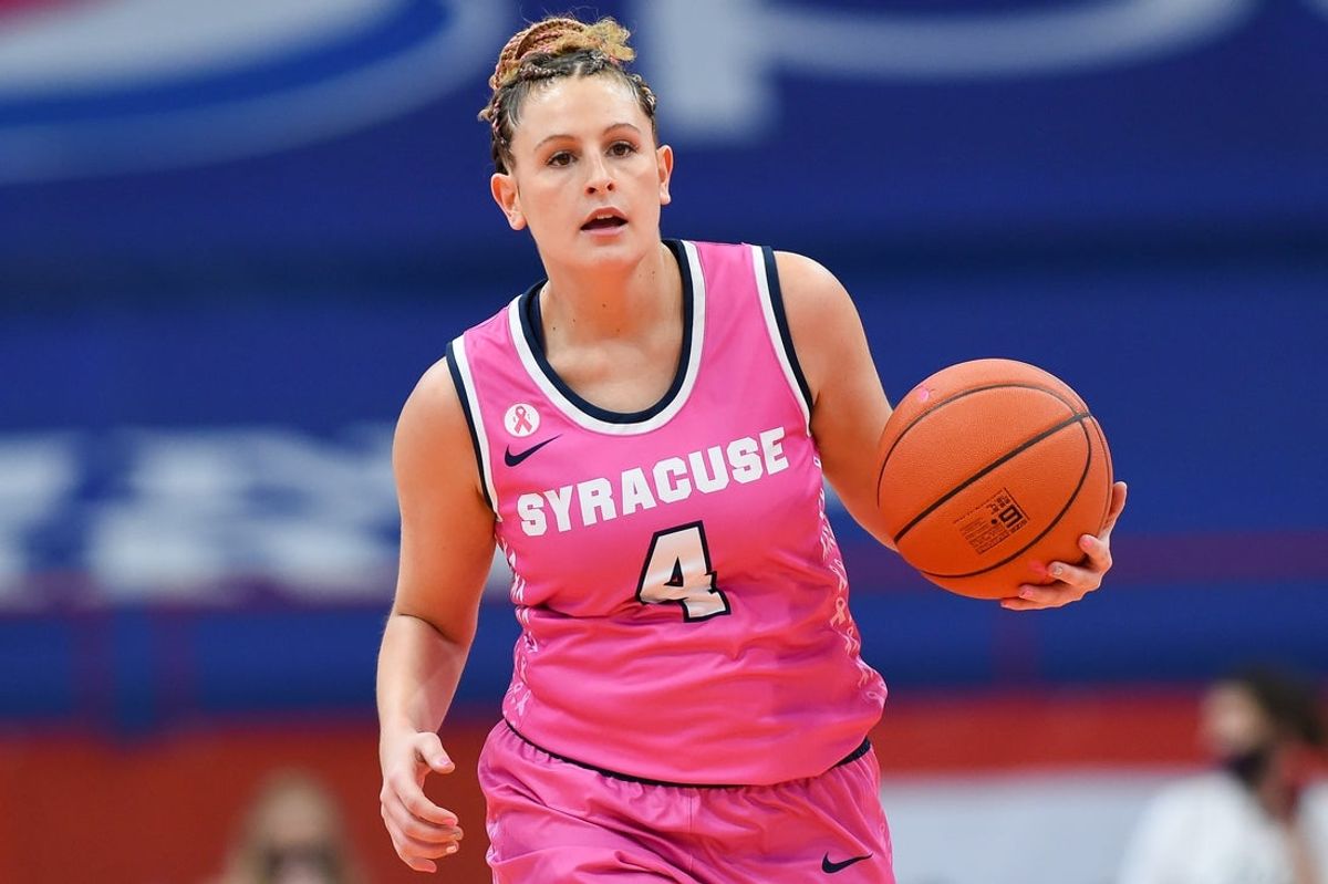 Feb 28, 2021; Syracuse, New York, USA; Syracuse Orange guard Tiana Mangakahia (4) dribbles up the court against the NC State Wolfpack during the first half at the Carrier Dome. Mandatory Credit: Rich Barnes-Imagn Images