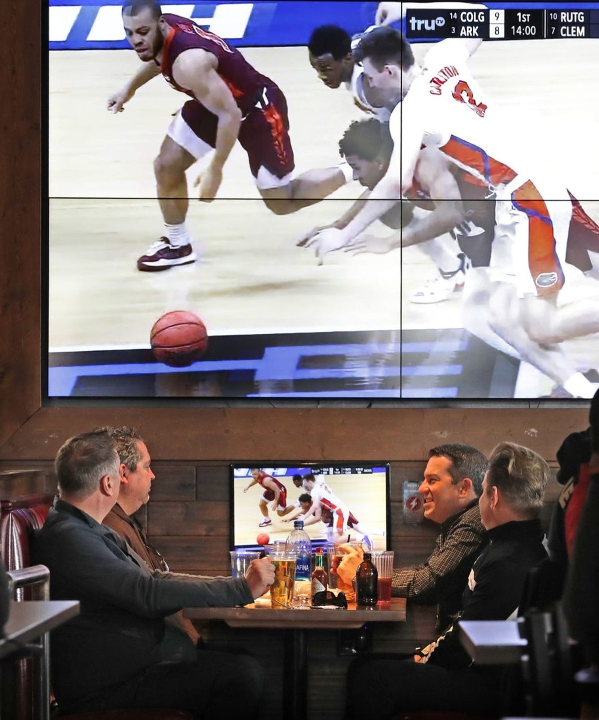 A sea of TVs keeps patrons in the NCAA March Madness loop Friday, March 19, 2021 at The District Tap in Indianapolis.

Ncaa March Madness Begins In Indy