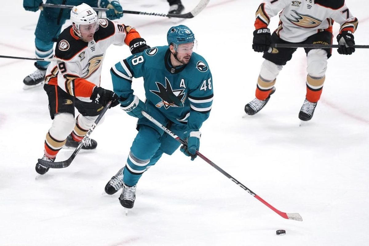 Jan 20, 2024; San Jose, California, USA; San Jose Sharks center Tomas Hertl (48) skates with the puck against Anaheim Ducks center Sam Carrick (39) during the third period at SAP Center at San Jose.