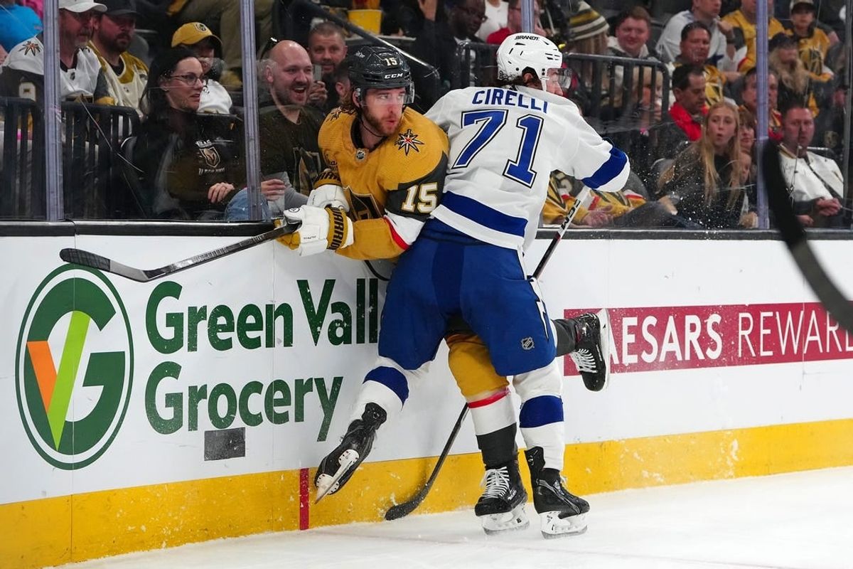 Mar 19, 2024; Las Vegas, Nevada, USA; Tampa Bay Lightning center Anthony Cirelli (71) checks Vegas Golden Knights defenseman Noah Hanifin (15) during the first period at T-Mobile Arena.