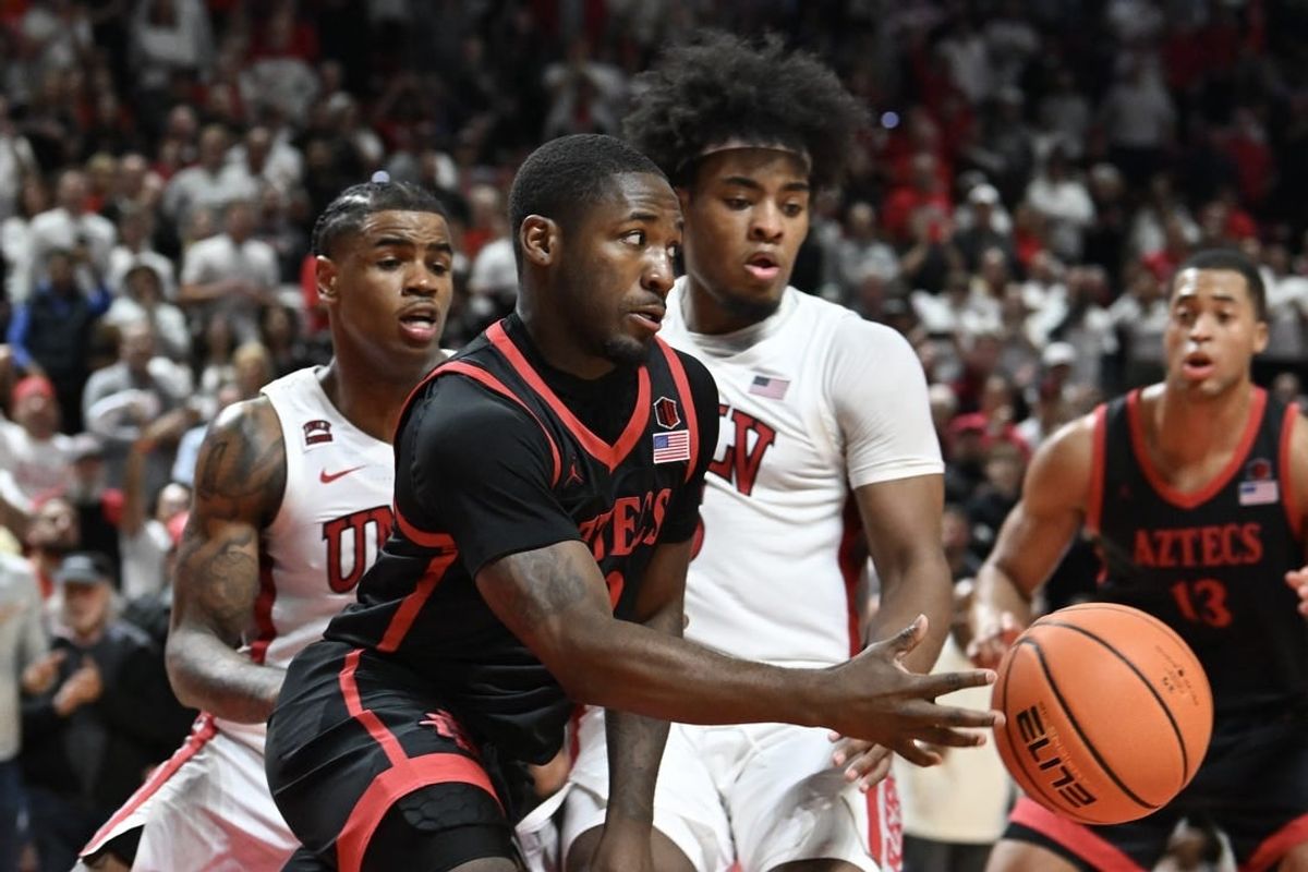 Mar 5, 2024; Las Vegas, Nevada, USA; San Diego State Aztecs guard Darrion Trammell (12) passes the ball against the UNLV Rebels in the second half at Thomas & Mack Center.
