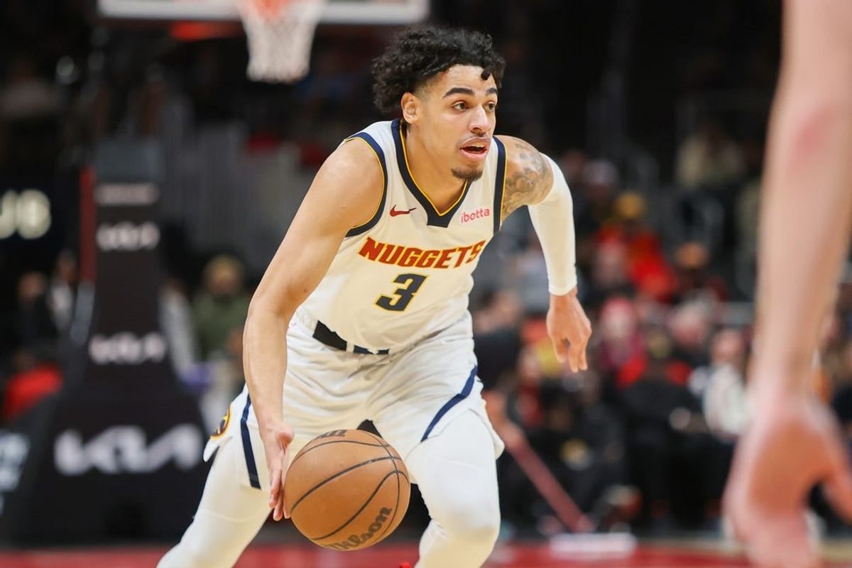 Dec 11, 2023; Atlanta, Georgia, USA; Denver Nuggets guard Julian Strawther (3) dribbles against the Atlanta Hawks in the second quarter at State Farm Arena.