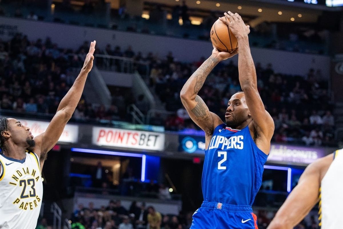 Dec 18, 2023; Indianapolis, Indiana, USA; LA Clippers forward Kawhi Leonard (2) shoots the ball while Indiana Pacers forward Aaron Nesmith (23) defends in the first quarter at Gainbridge Fieldhouse.