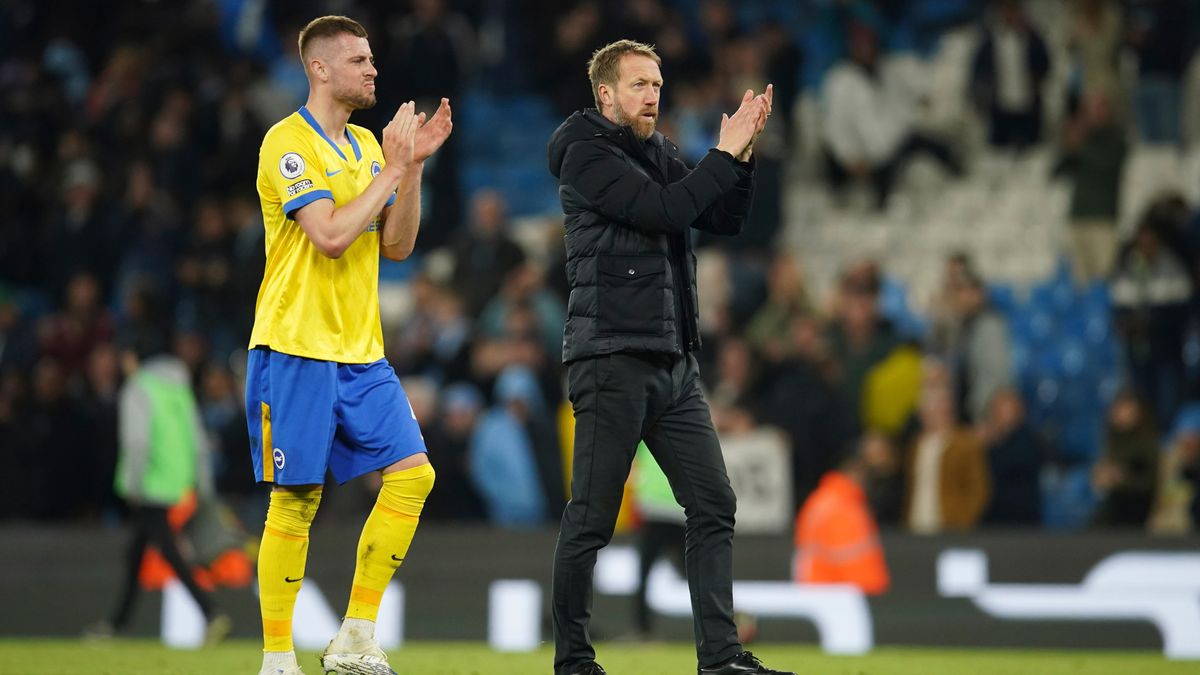Brighton’s head coach Graham Potter, right, applauds fans at the end of the English Premier League soccer match between Manchester City and Brighton and Hove Albion at the Etihad Stadium in Manchester, England, April 20, 2022.