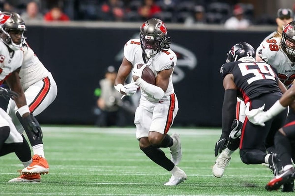 Dec 10, 2023; Atlanta, Georgia, USA; Tampa Bay Buccaneers running back Rachaad White (1) runs the ball against the Atlanta Falcons in the first half at Mercedes-Benz Stadium.