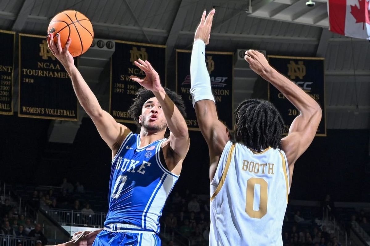 Jan 6, 2024; South Bend, Indiana, USA; Duke Blue Devils guard Jared McCain (0) goes up for a shot as Notre Dame Fighting Irish forward Carey Booth (0) defends in the second half at the Purcell Pavilion.