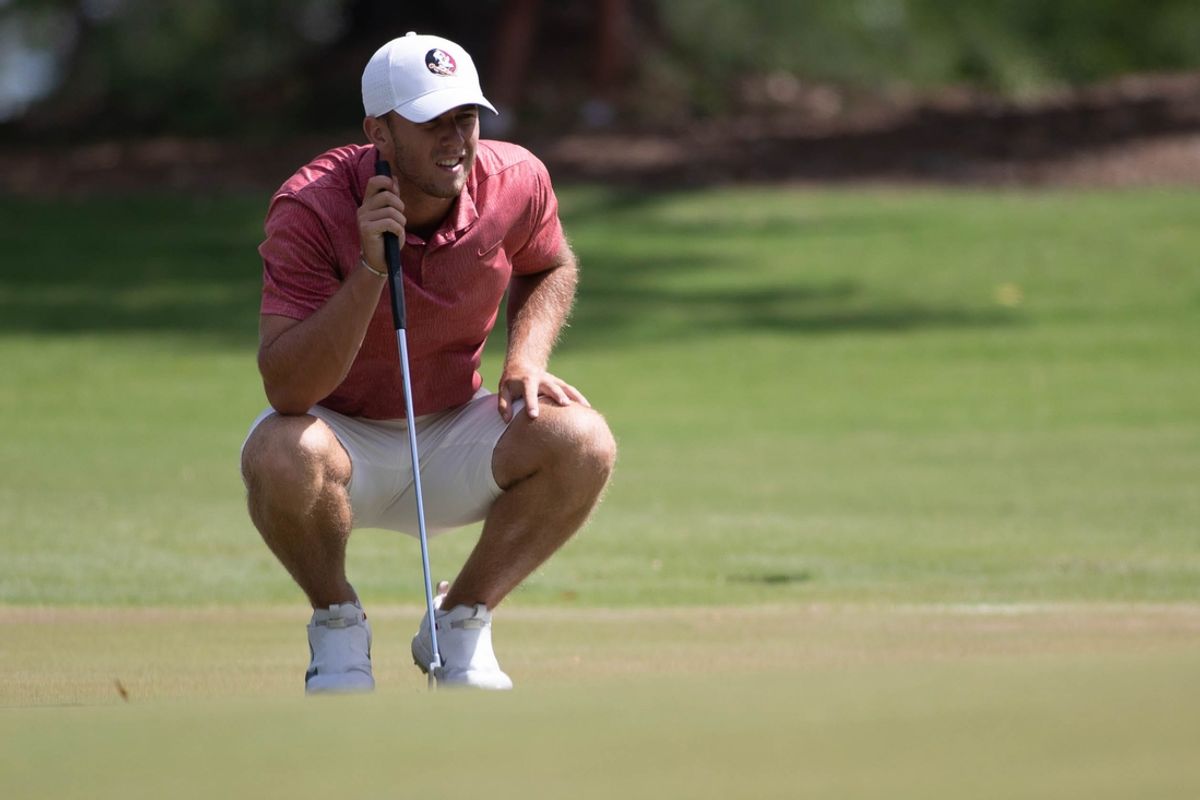 Florida State University's Frederik Kjettrup eyes the green before putting during the NCAA Tallahassee Regional at Seminole Legacy Golf Club in Tallahassee Tuesday, May 18, 2021.
