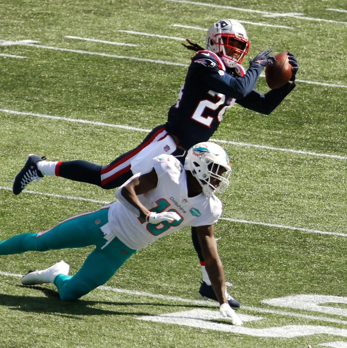 Patriots cornerback Stephon Gilmore intercepts a pass meant for the Dolphins    Preston Williams in the first half of the Patriots 2020 season-opener. [The Providence Journal / Kris Craig]

Pats Defense Ruins The Fitzmagic Show