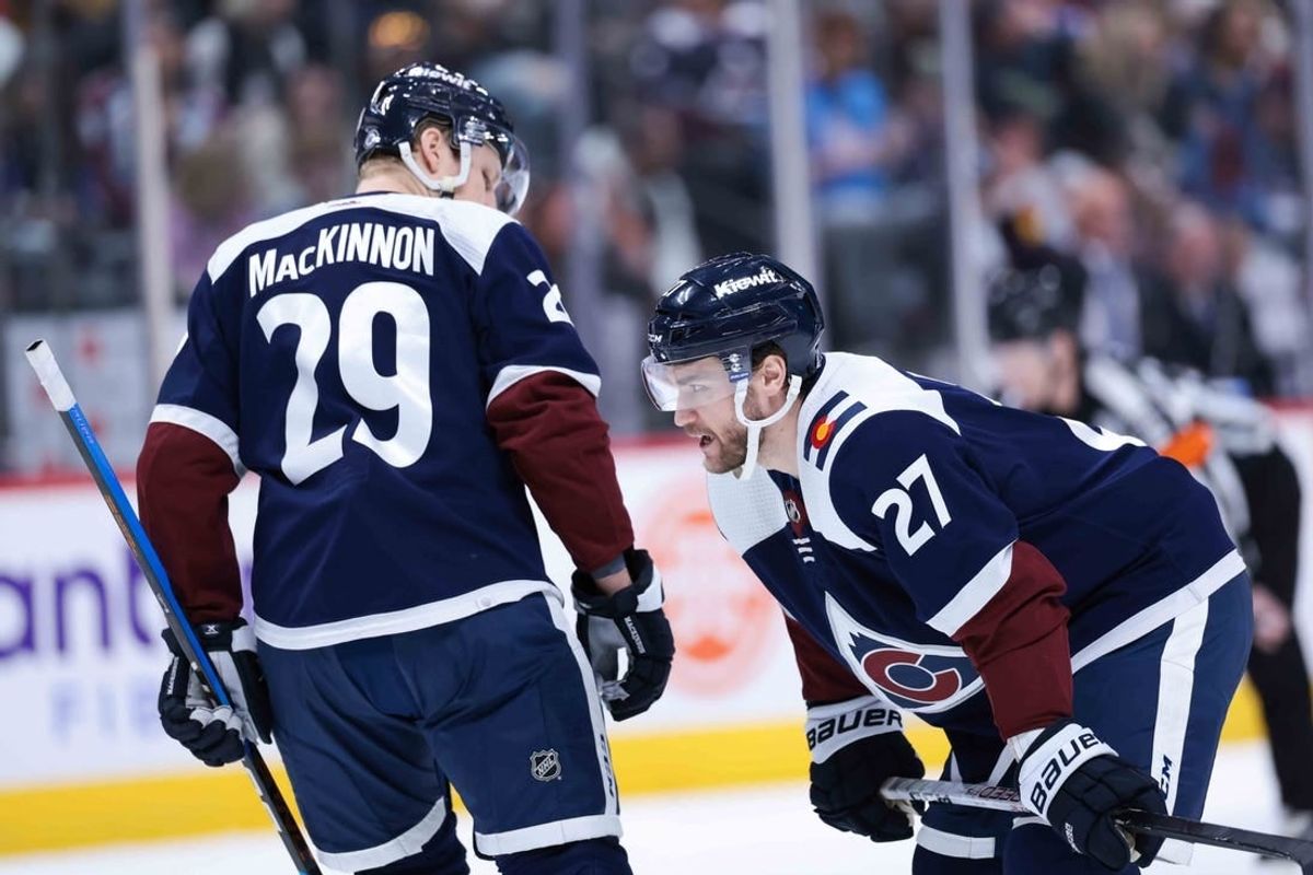 Mar 30, 2024; Denver, Colorado, USA; Colorado Avalanche left wing Jonathan Drouin (27) and Nathan MacKinnon (29) talk before a face off during the second period against the Nashville Predators at Ball Arena.