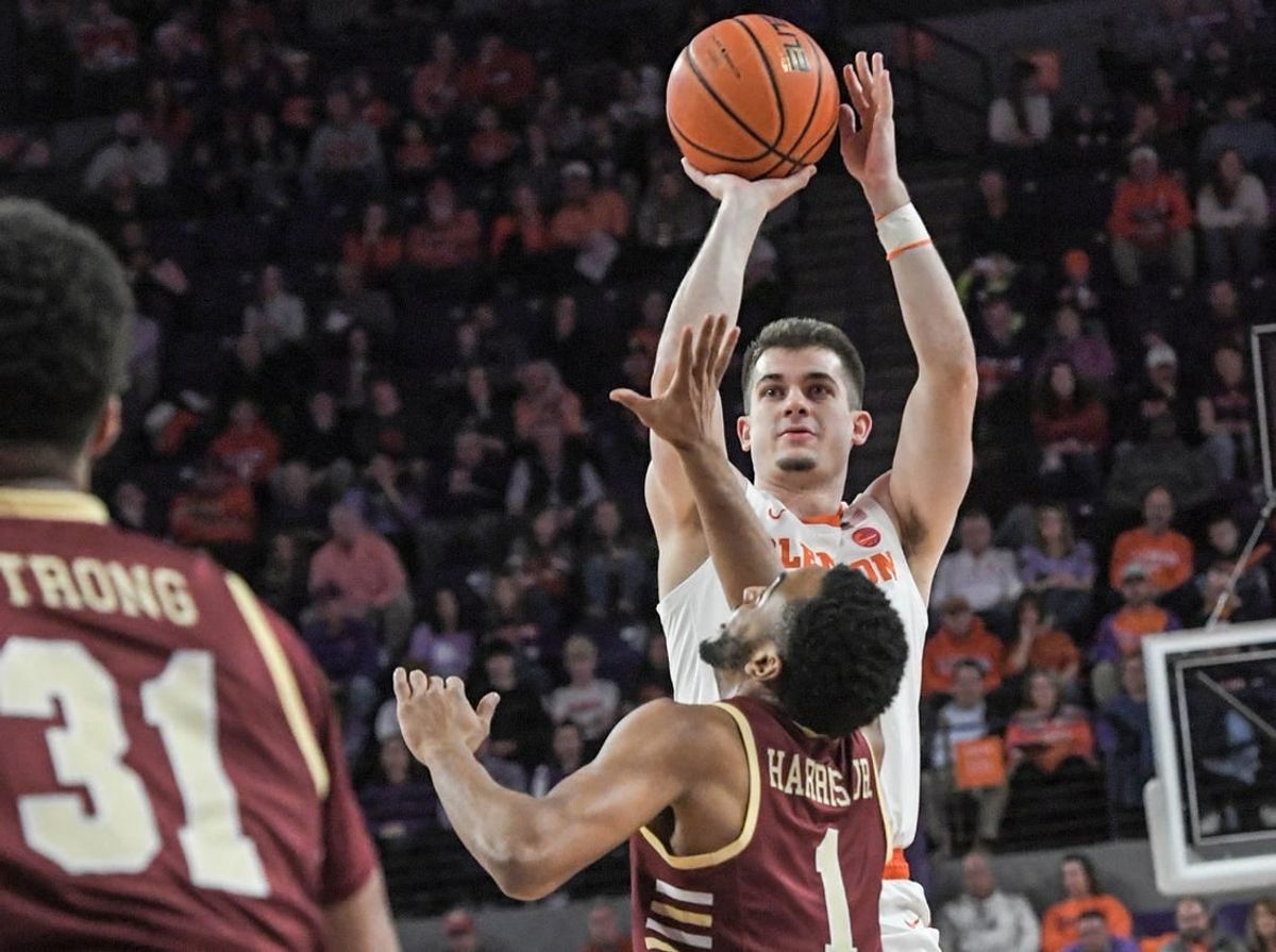 Jan 13, 2024; Clemson, South Carolina, USA; Clemson Tigers guard Joseph Girard III shoots the ball against Boston College Eagles guard Claudell Harris Jr. (1) during the first half at Littlejohn Coliseum.