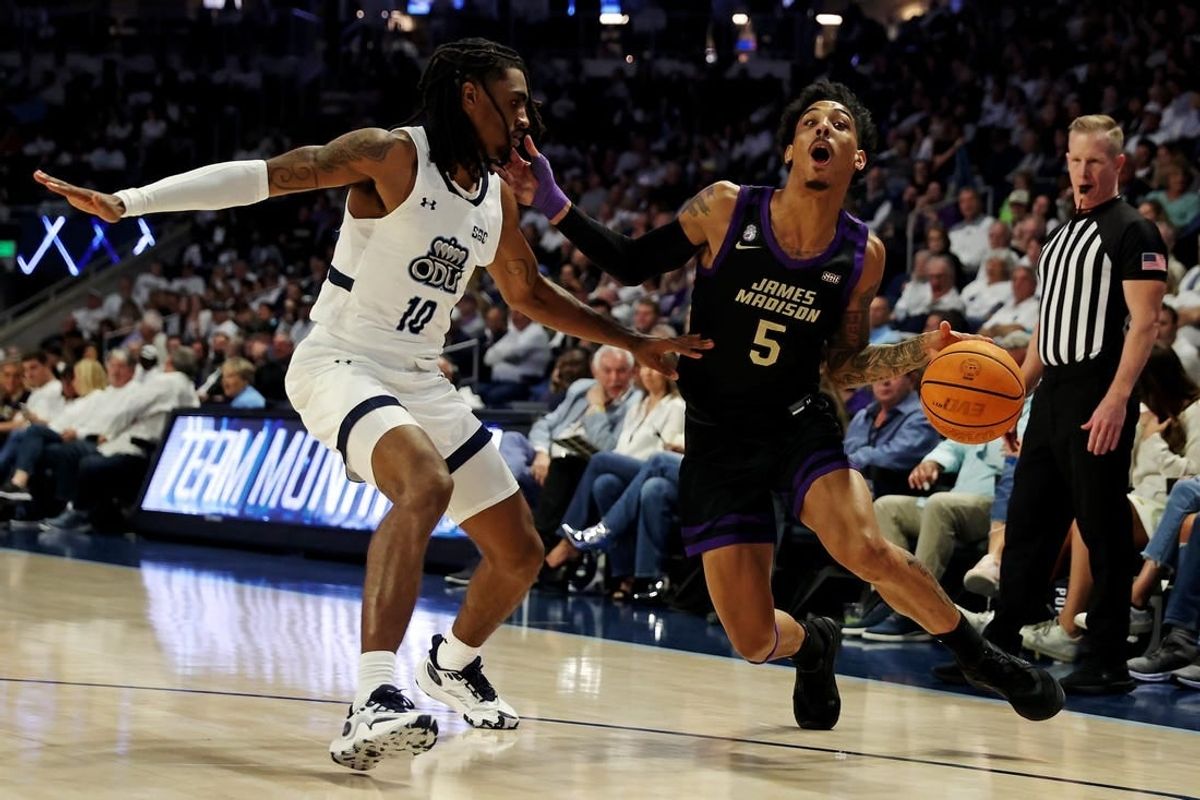 Dec 9, 2023; Norfolk, Virginia, USA; James Madison Dukes guard Terrence Edwards (5) drives to the basket against Old Dominion Monarchs guard Tyrone Williams (10) at Chartway Arena at the Ted Constant Convocation Center.