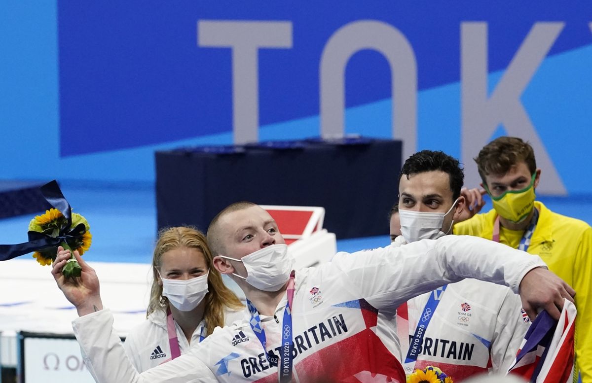 Mask-wearing protocol in place in Tokyo is returning for some teams in Paris. Adam Peaty (GBR), pictured in Tokyo in 2021, tested positive for COVID after claiming silver in the butterfly this week. Mandatory Credit: Rob Schumacher-USA TODAY Sports