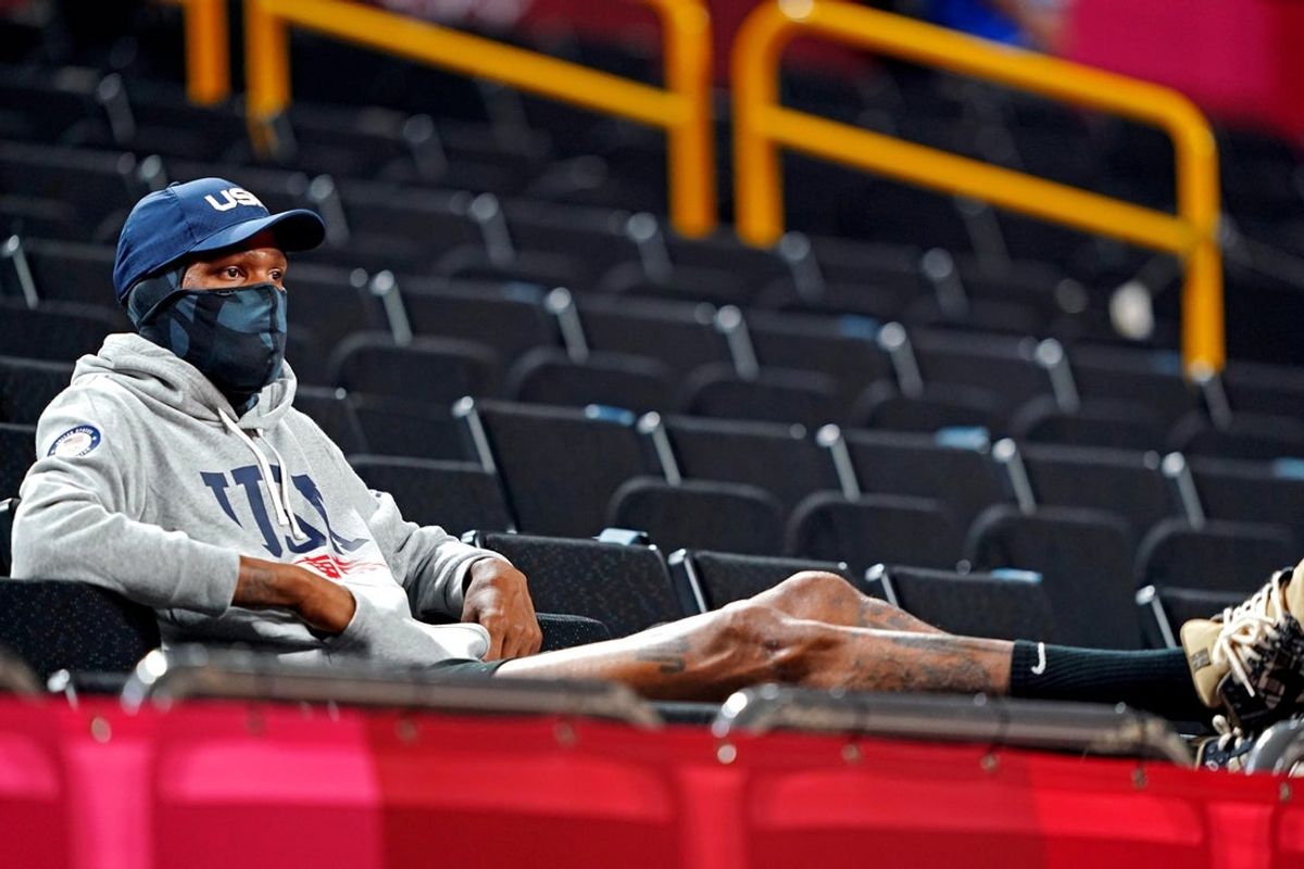 Aug 6, 2021; Saitama, Japan; USA men's team player Kevin Durant looks on as the  United States play Serbia in the women's basketball semifinal during the Tokyo 2020 Olympic Summer Games at Saitama Super Arena. Mandatory Credit: Kareem Elgazzar-Imagn Images