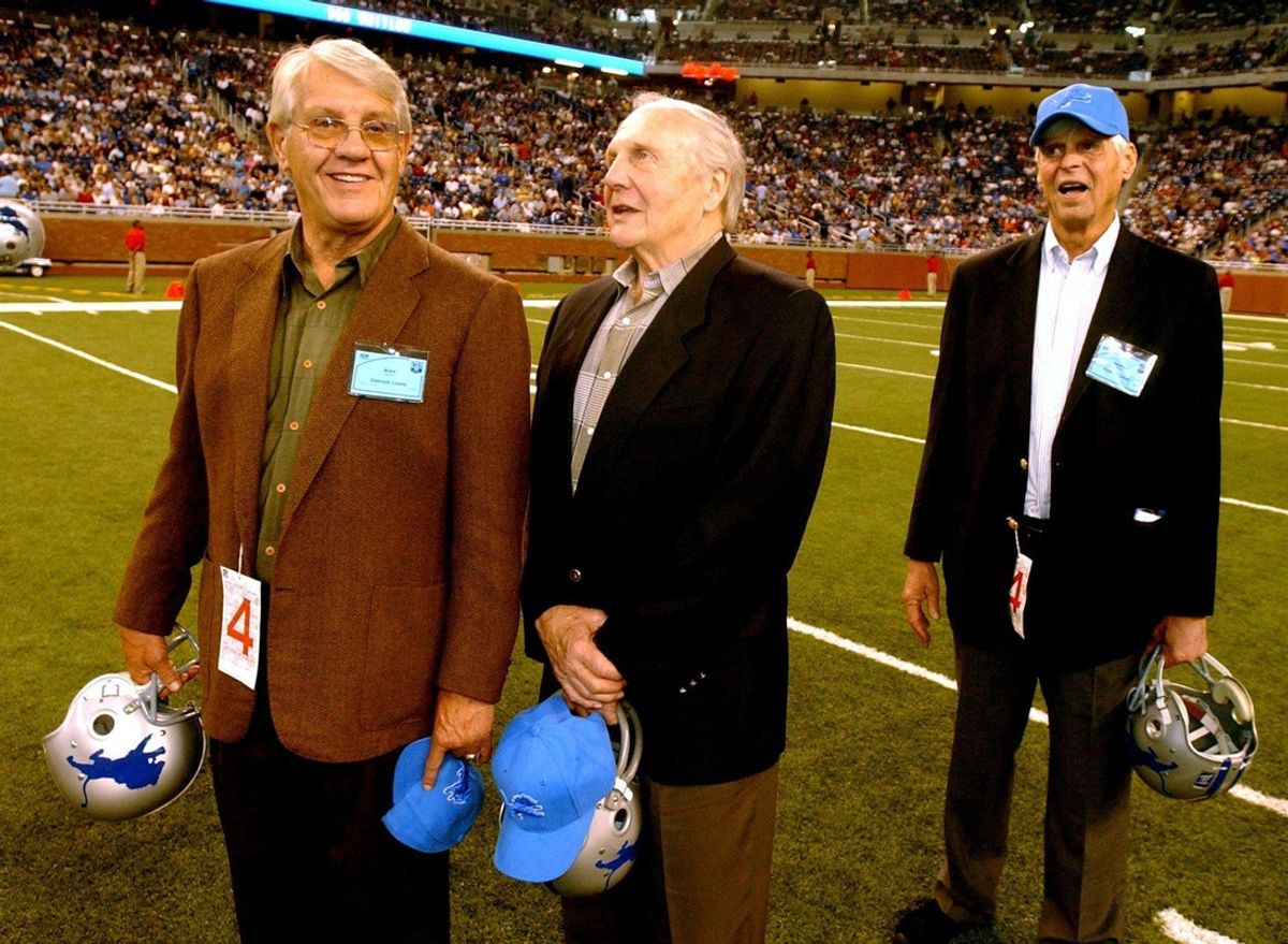 Detroit Lions greats Alex Karras (left) and Joe Schmidt talk as \"Paper Lion\" author George Plimpton looks on during halftime ceremonies at a Sept. 21, 2003 Lions game at Ford Field in Detroit.

Ust Lions6 092103 Es