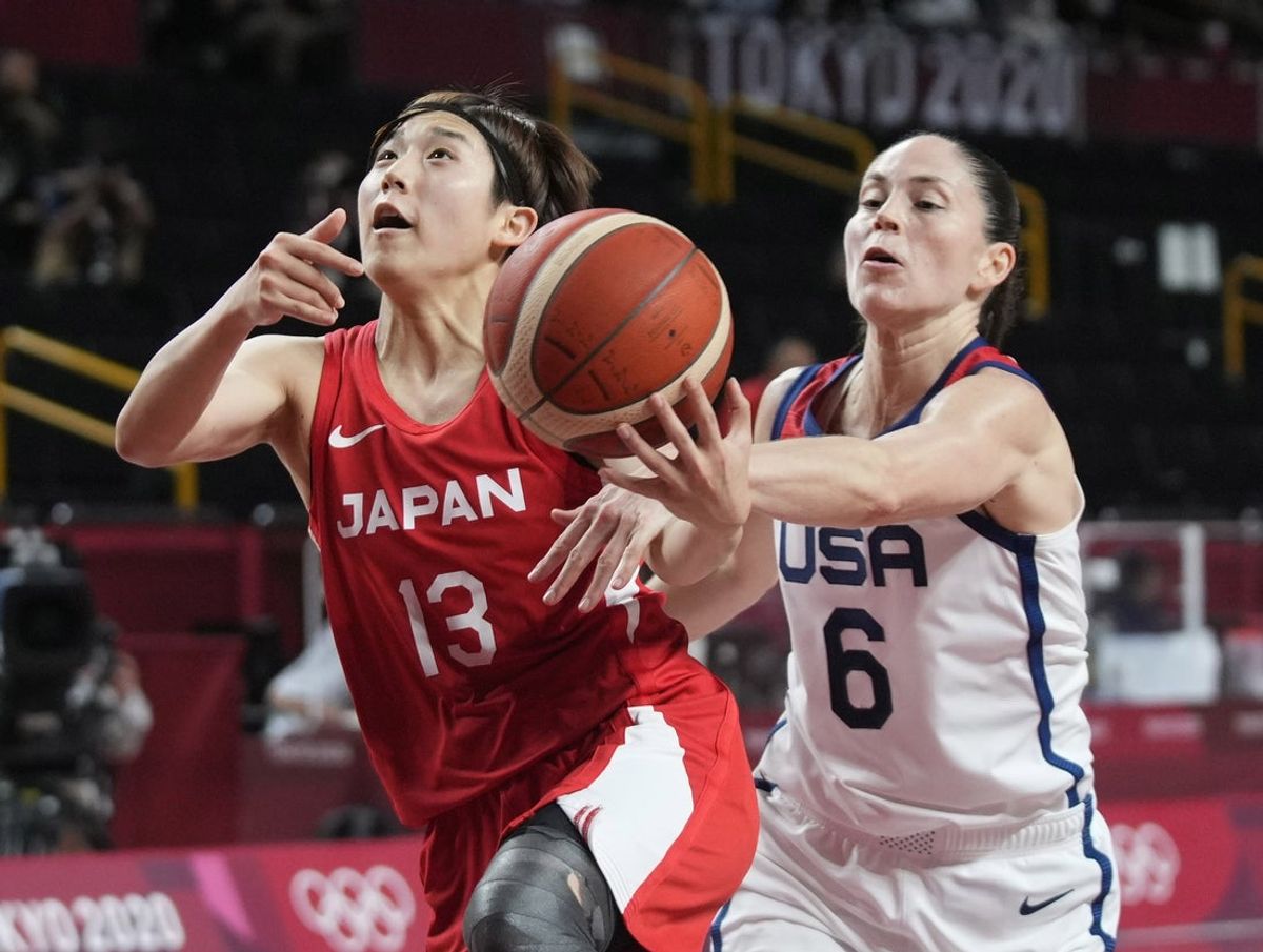 Aug 8, 2021; Saitama, Japan; United States guard Sue Bird (6) knocks the ball away from Japan point guard Rui Machida (13) in the women's basketball gold medal match during the Tokyo 2020 Olympic Summer Games at Saitama Super Arena. Mandatory Credit: James Lang-Imagn Images