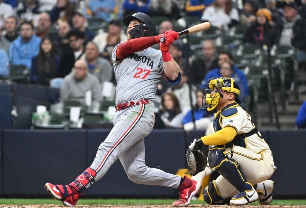 Apr 3, 2024; Milwaukee, Wisconsin, USA; Minnesota Twins catcher Ryan Jeffers (27) hits a home run against the Milwaukee Brewers in the seventh inning at American Family Field.