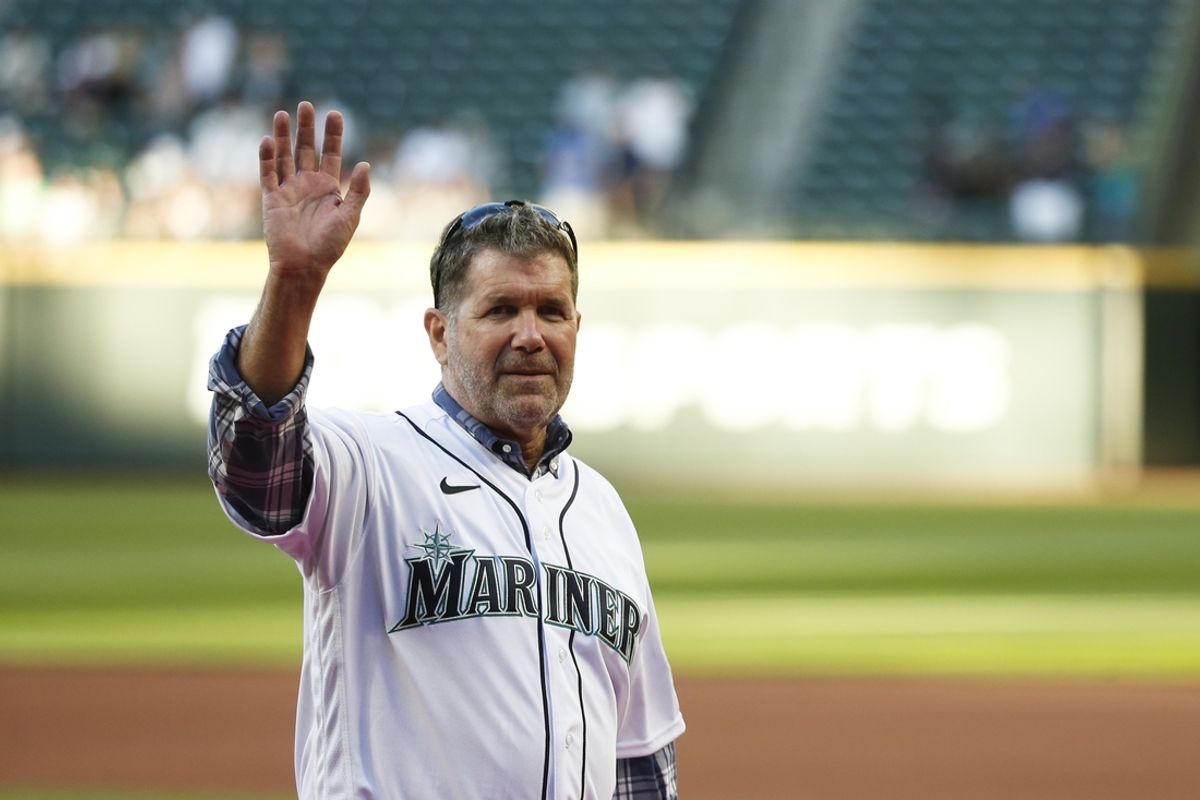 Aug 11, 2021; Seattle, Washington, USA; Former Seattle Mariners player Edgar Martinez (11) reacts after throwing out the first pitch before a game against the Texas Rangers at T-Mobile Park. Mandatory Credit: Joe Nicholson-USA TODAY Sports