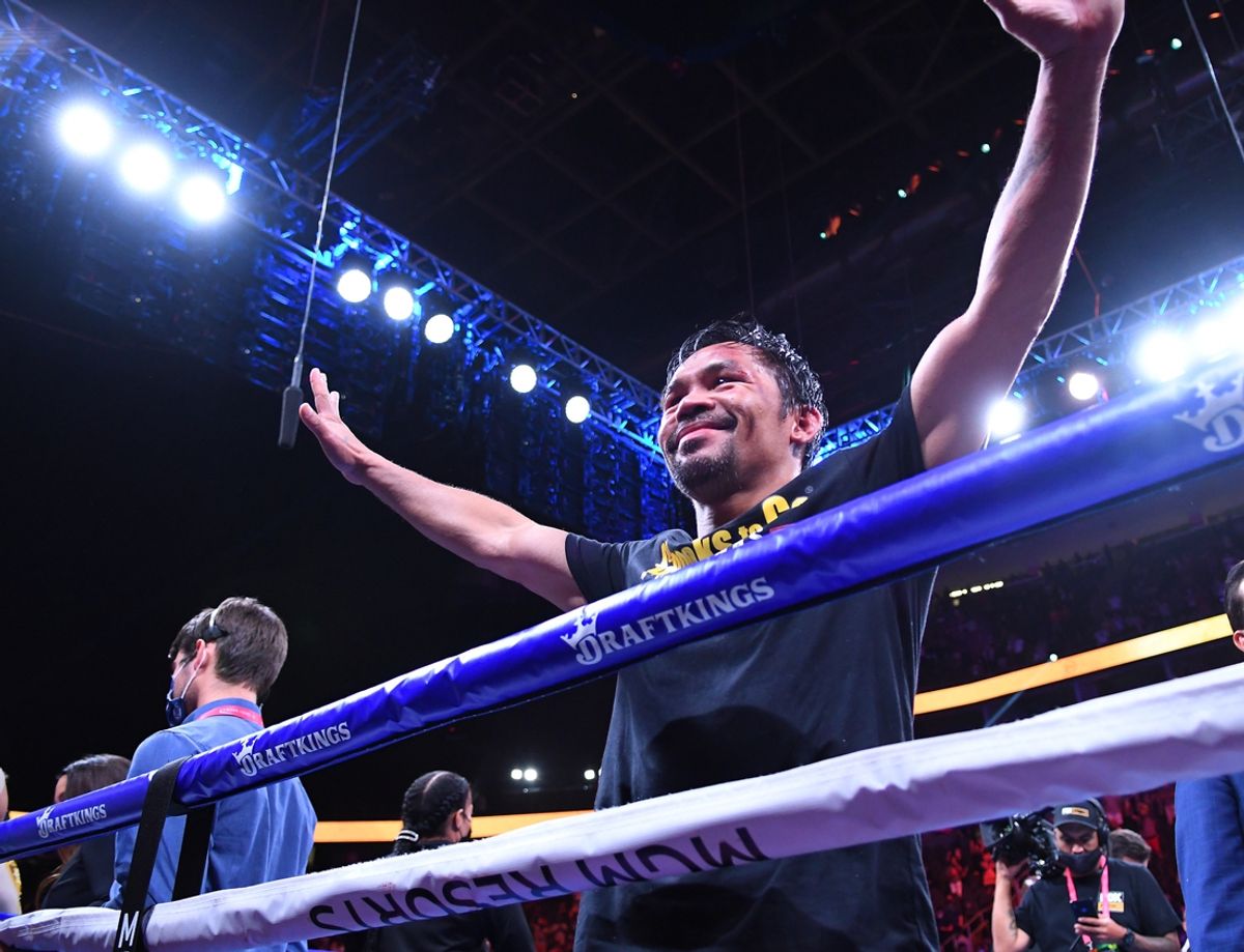 Aug 21, 2021; Las Vegas, Nevada; Manny Pacquiao waves to fans after losing in a world welterweight championship bout in a decision to Yordenis Ugas at T-Mobile Arena. Mandatory Credit: Stephen R. Sylvanie-USA TODAY Sports