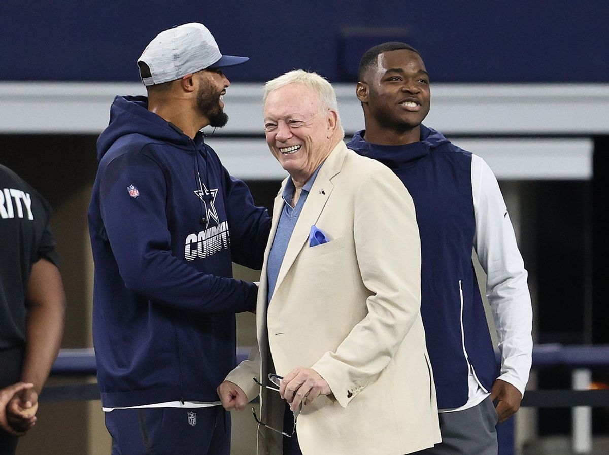 Aug 29, 2021; Arlington, Texas, USA; Dallas Cowboys quarterback Dak Prescott , owner Jerry Jones and receiver Amari Cooper talk prior to the game against the Jacksonville Jaguars at AT&T Stadium. Mandatory Credit: Matthew Emmons-Imagn Images