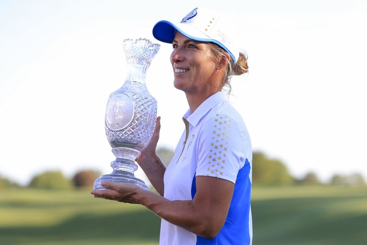 Sep 6, 2021; Toledo, Ohio, USA; Mel Reid of Team Europe poses for a photo with the Solheim Cup after defeating Team USA during competition rounds of the Solheim Cup golf tournament at Inverness Club. Mandatory Credit: Aaron Doster-Imagn Images