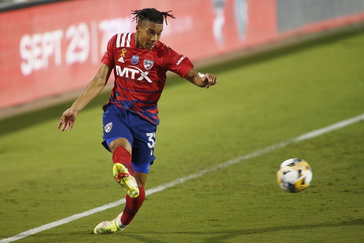 Sep 11, 2021; Frisco, Texas, USA; FC Dallas defender Justin Che (32) kicks the ball against the San Jose Earthquakes in the first half at Toyota Stadium. Mandatory Credit: Tim Heitman-Imagn Images