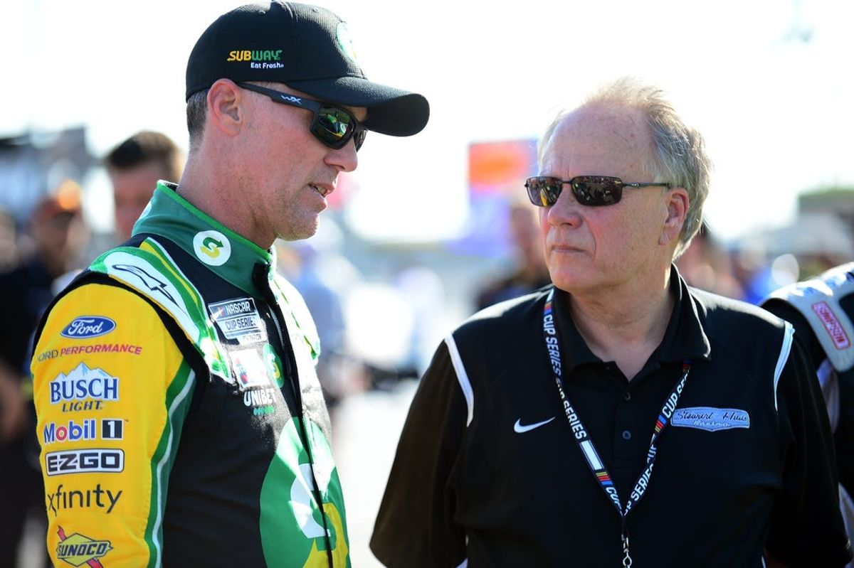 Sep 26, 2021; Las Vegas, Nevada, USA; NASCAR Cup Series driver Kevin Harvick (4) speaks with team owner Gene Haas before the South Point 400 at Las Vegas Motor Speedway. Mandatory Credit: Gary A. Vasquez-USA TODAY Sports