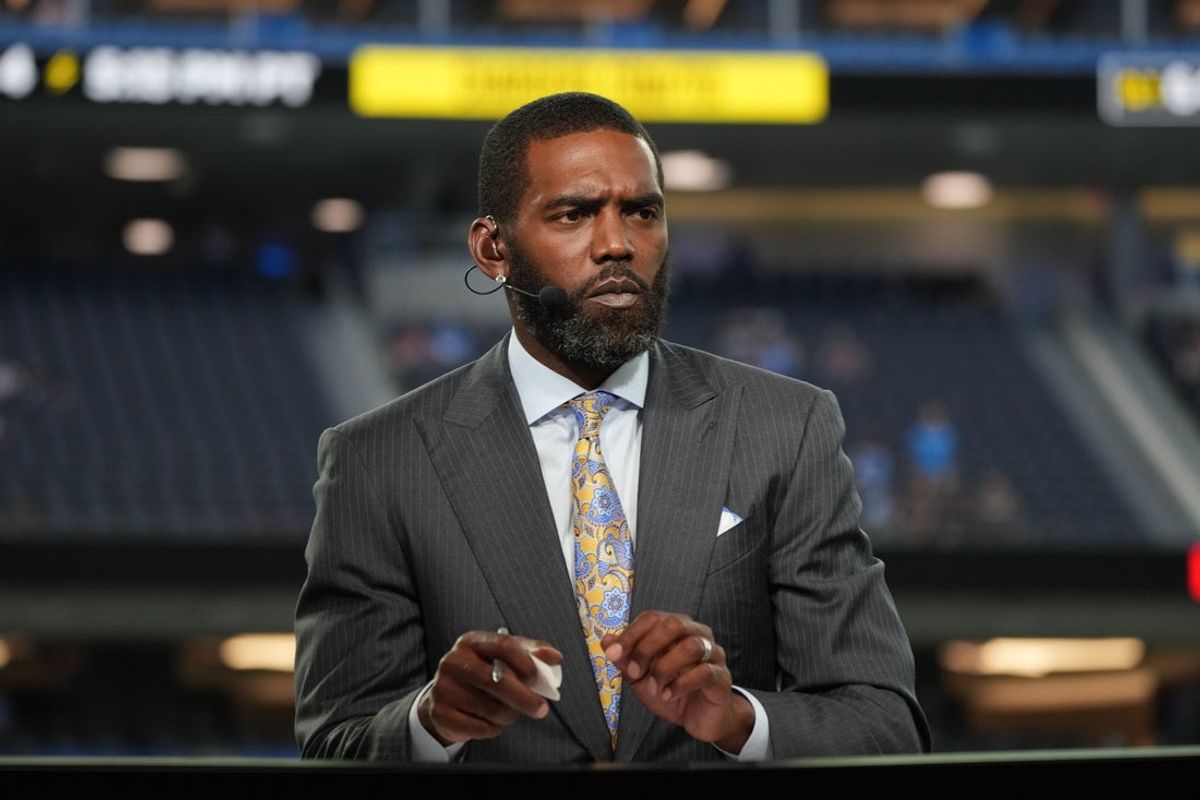 Oct 4, 2021; Inglewood, California, USA; Randy Moss broadcasts from the ESPN Monday Night Football Countdown set before a game between the Los Angeles Chargers and the Las Vegas Raiders at SoFi Stadium. Mandatory Credit: Kirby Lee-Imagn Images
